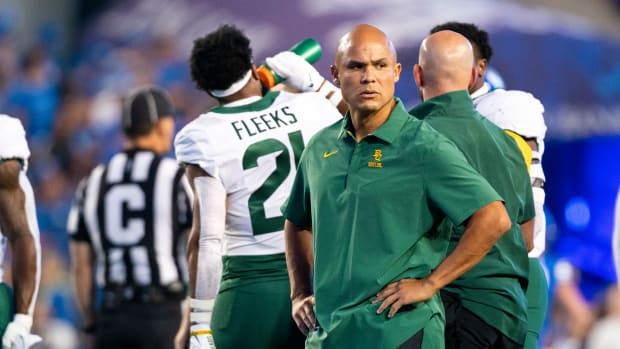 Baylor head coach Dave Aranda standing during warmups against BYU.